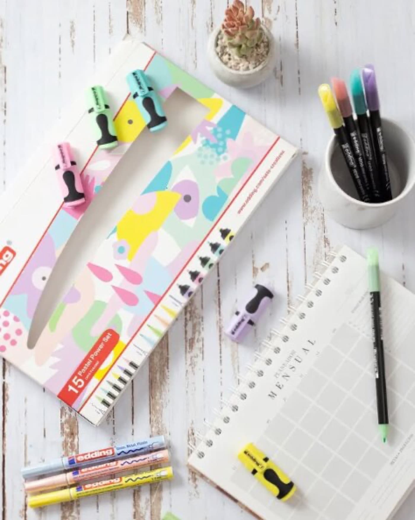 A set of markers laid out on a table